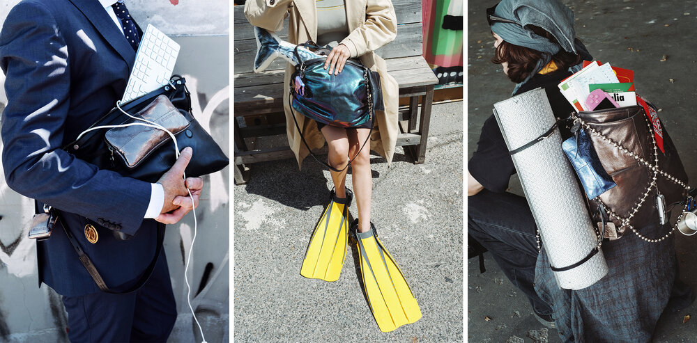 Three people carry bags filled with mismatched items: a businessman with office supplies, a person in flippers with a shiny INA KENT bag, and someone with a yoga mat and various objects.