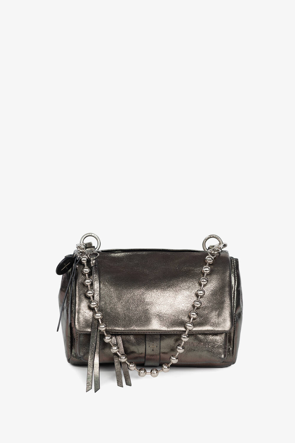 A metallic silver INA KENT crossbody bag with a flap closure, decorative beaded chain strap, and leather tassel accents, displayed against a plain white background.