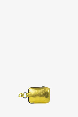 A small, rectangular yellow metallic zippered pouch with a keychain attachment, crafted by INA KENT.