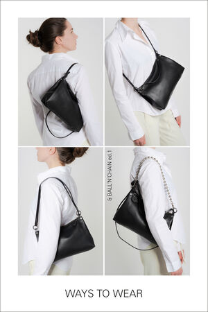 Three images showcasing the versatile INA KENT black leather bag: worn across the back, across the chest, and elegantly on the shoulder. The model pairs it effortlessly with a white shirt and cream pants.