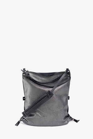 The metallic gray leather backpack from INA KENT features an adjustable strap and two small drawstring closures on the sides, positioned upright against a plain background.