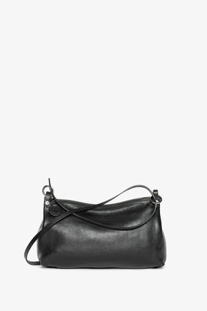  Product image of the INA KENT ORNAMENT ed.2 bag made of smooth leather in black. The bag impresses with its minimalist design and versatile carrying options with a simple, elegant leather strap.