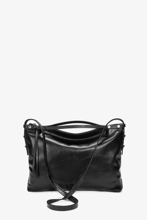 The INA KENT black leather shoulder bag showcases a sleek design, featuring a long strap, zipper closure, and minimalist detailing.