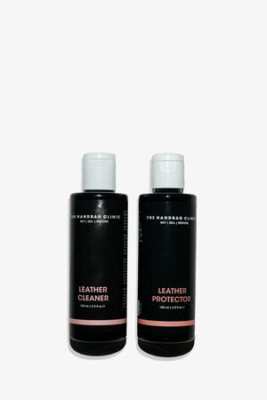 Zwei schwarze Flaschen mit den Aufschriften "Leather Cleaner" und "Leather Protector" von The Handbag Clinic, die perfekt für INA KENT-Taschen geeignet sind, stehen nebeneinander vor einem weißen Hintergrund.