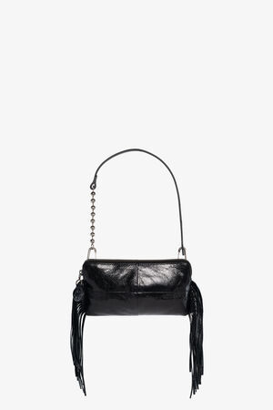 A small black leather INA KENT handbag with a short strap, metallic bead detail, and fringe tassels hanging from each side, displayed against a plain white background.