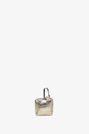 A small metallic gold pouch by INA KENT with a carabiner clip attached at the top, displayed against a plain white background.