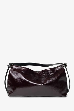 A glossy, dark burgundy INA KENT shoulder bag with a slouchy shape, black adjustable strap, and simple design set against a plain white background.