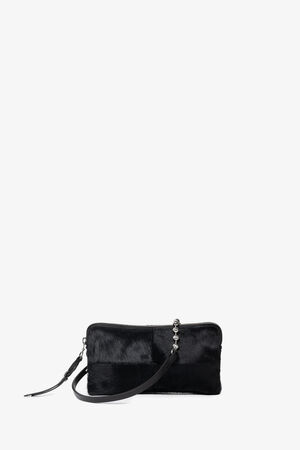 Rectangular black INA KENT clutch with a wrist strap and zipper, featuring a textured, fur-like surface, displayed against a plain white background.