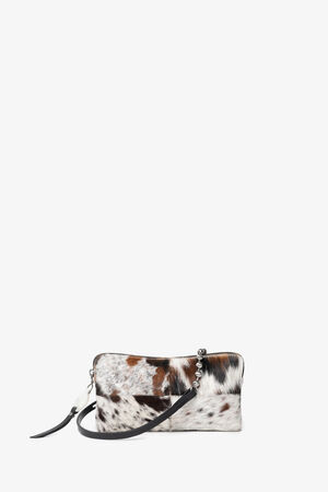 Small rectangular INA KENT clutch with a cowhide pattern, zipper closure, and a black leather wrist strap, displayed against a plain white background.
