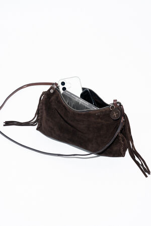 An INA KENT brown suede shoulder bag with fringe, containing a smartphone and a book.