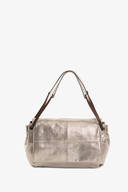 A metallic silver handbag by INA KENT with double brown handles, featuring a soft rectangular shape and a subtle logo on the front.