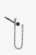 A silver beaded chain by INA KENT with two lobster clasps, a round tag, and a leather strap attachment on a white background.