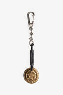 A metal keychain with a clasp, a black leather INA KENT tag, and a gold sheriff badge-shaped pendant marked "DEPUTY.