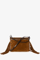 Brown suede INA KENT handbag with a zipper closure, long black strap, decorative round tag, and fringe detailing on both sides, displayed against a white background.