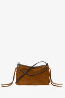 INA KENT brown suede crossbody bag with a zipper closure, long black strap, and decorative tassels on the sides, displayed against a plain white background.