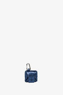 A small metallic blue INA KENT AirPods case with a front flap, carabiner clip, and textured finish, centered on a plain white background.